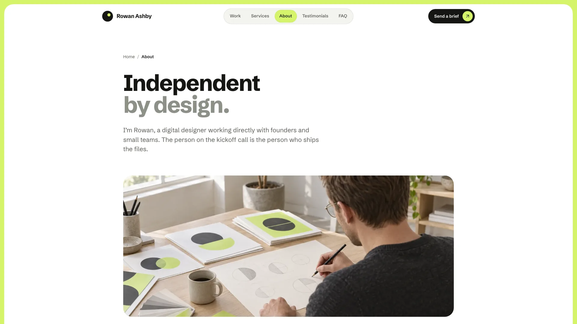 The About page: a breadcrumb, the two-tone heading Independent by design, a short intro and a photo of the designer sketching at a desk