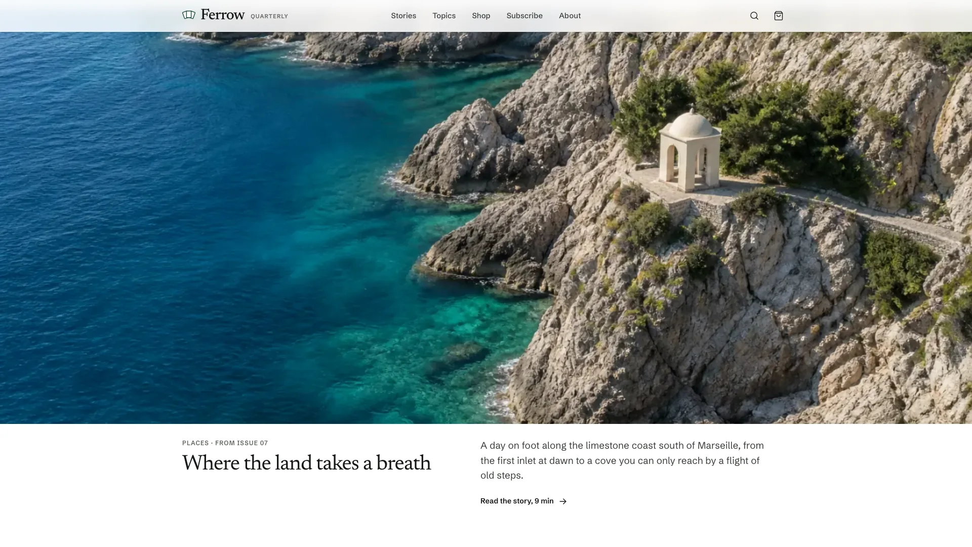 A full-bleed feature on the home page: an aerial photo of a limestone coast with a small white pavilion, above the story title Where the land takes a breath
